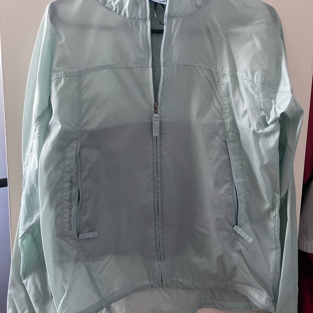Teal wind breaker, never worn
